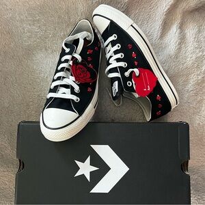 Converse with broken hearts and roses